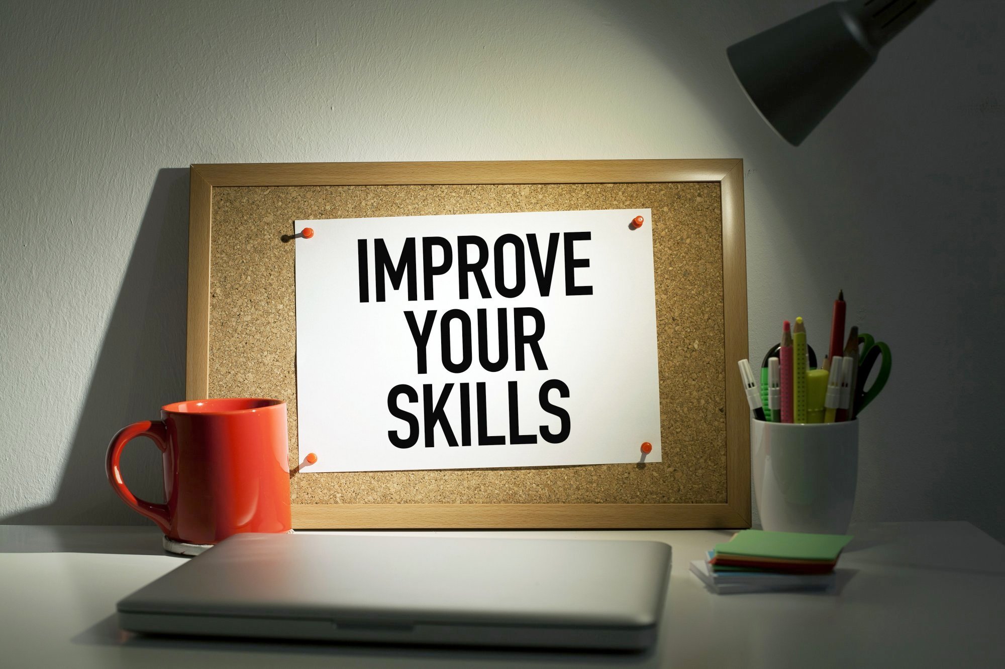 Pinboard with message that says improve your skills